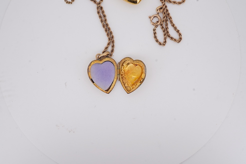 A modern embossed 9ct gold heart shaped locket, 21mm, on a similar 9ct gold rope twist chain, 46cm, together with one other yellow metal heart shaped locket, on a yellow metal chain, gross weight 14.5 grams. Condition -